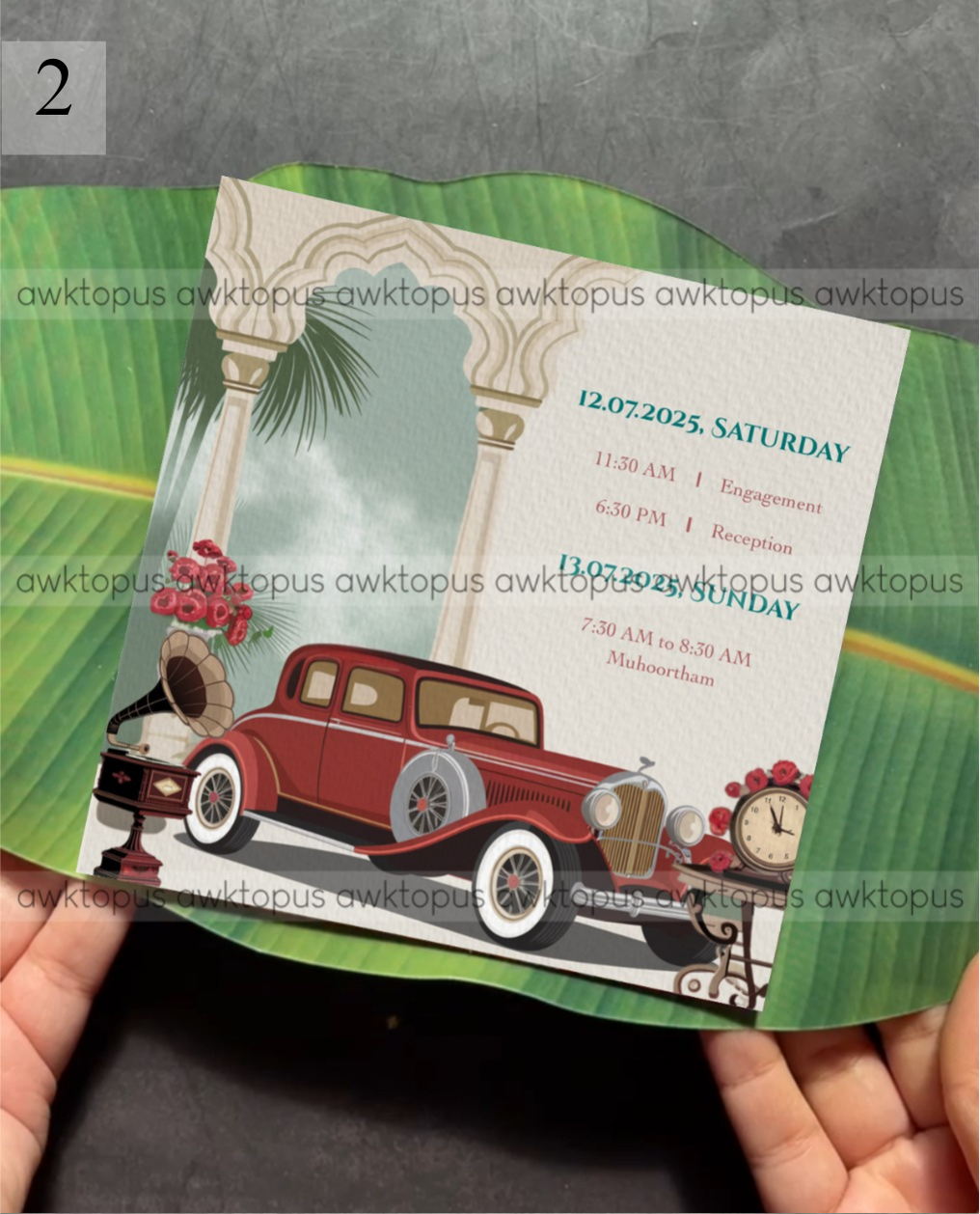 Invitation card with vintage car design held by hands on a green leaf background