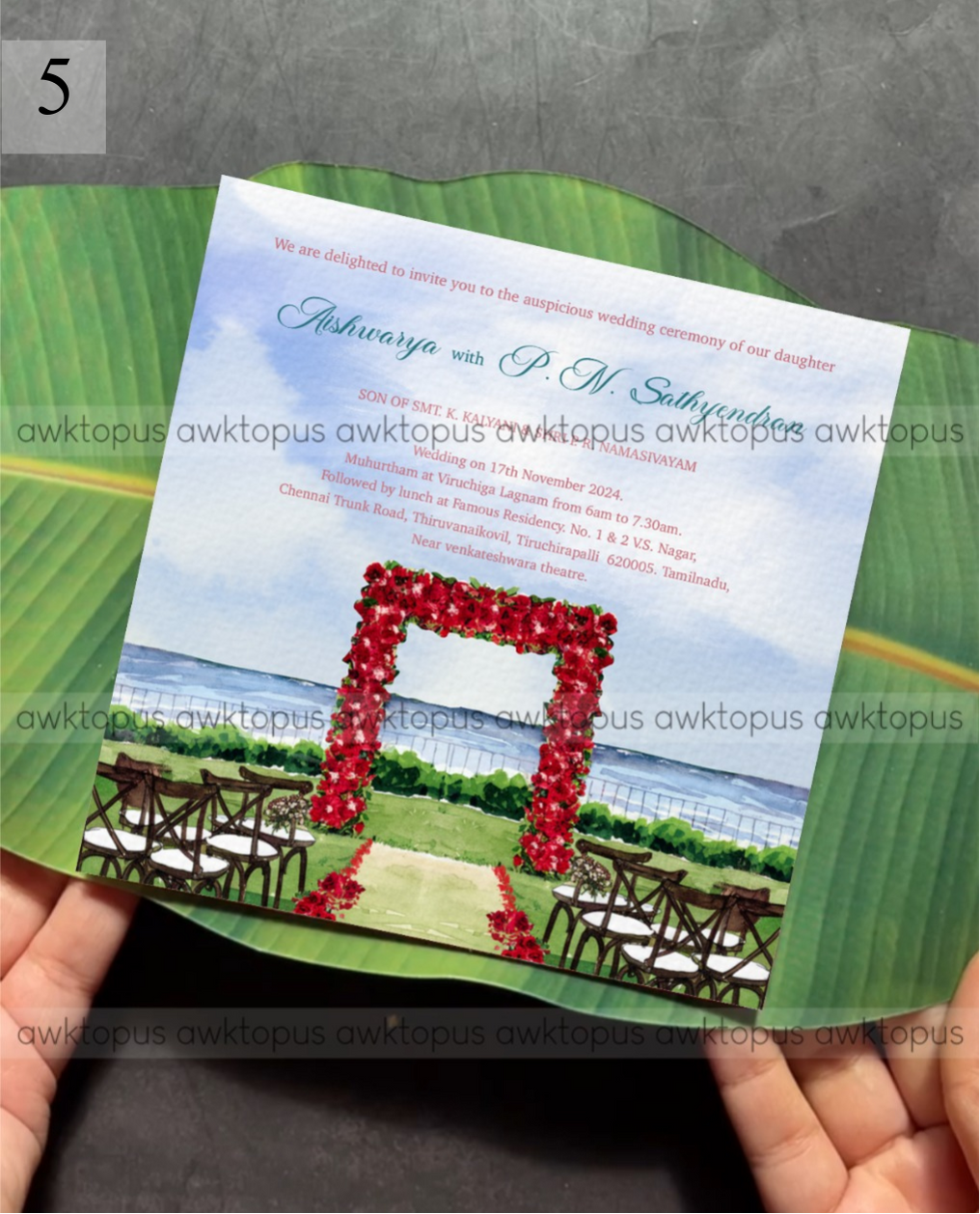 Wedding invitation card with red arch and ocean view on a green leaf background
